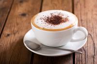 Cup Of Cappuccino Coffee On Wooden Table